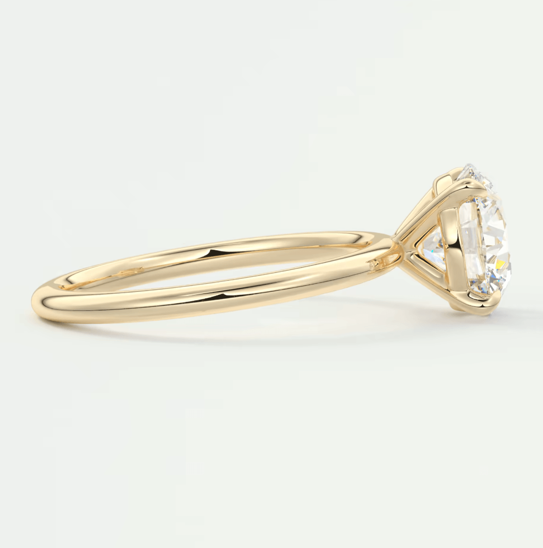 18k yellow gold engagement ring with a round diamond.