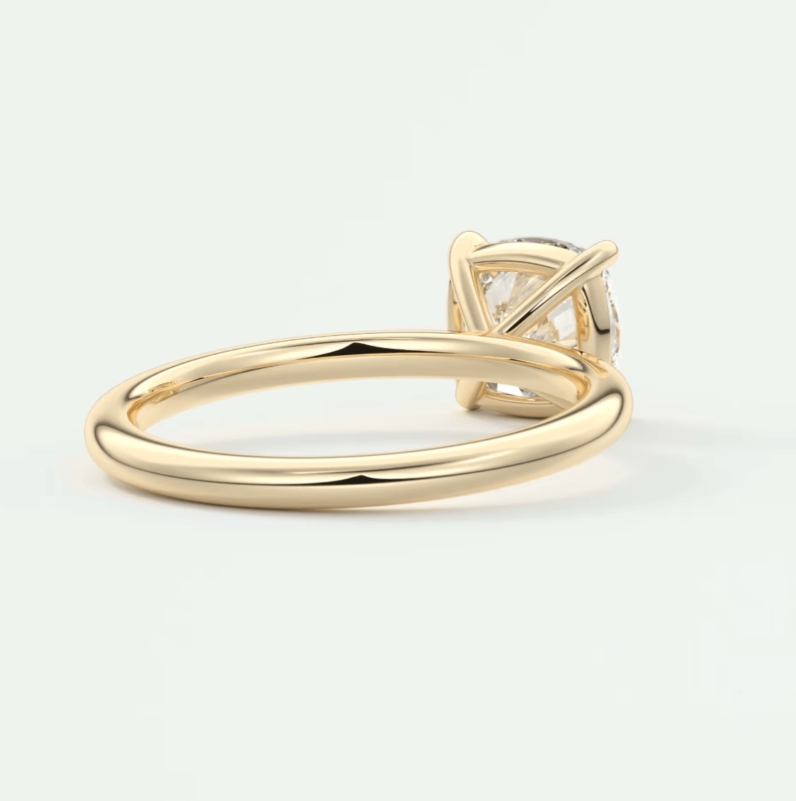 18-karat yellow gold engagement ring with a princess-cut diamond.