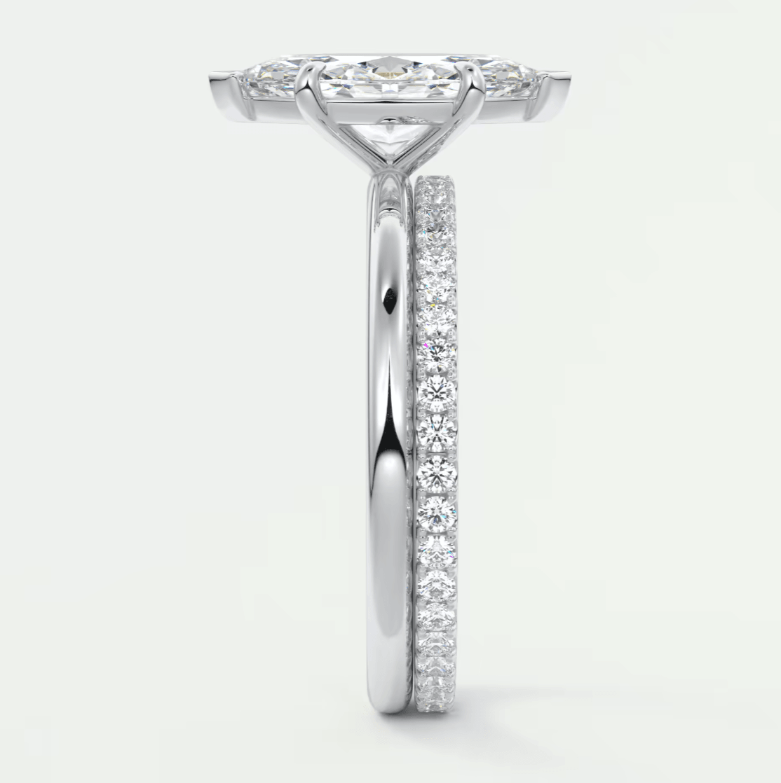 White diamond engagement ring with a halo design and side stones.