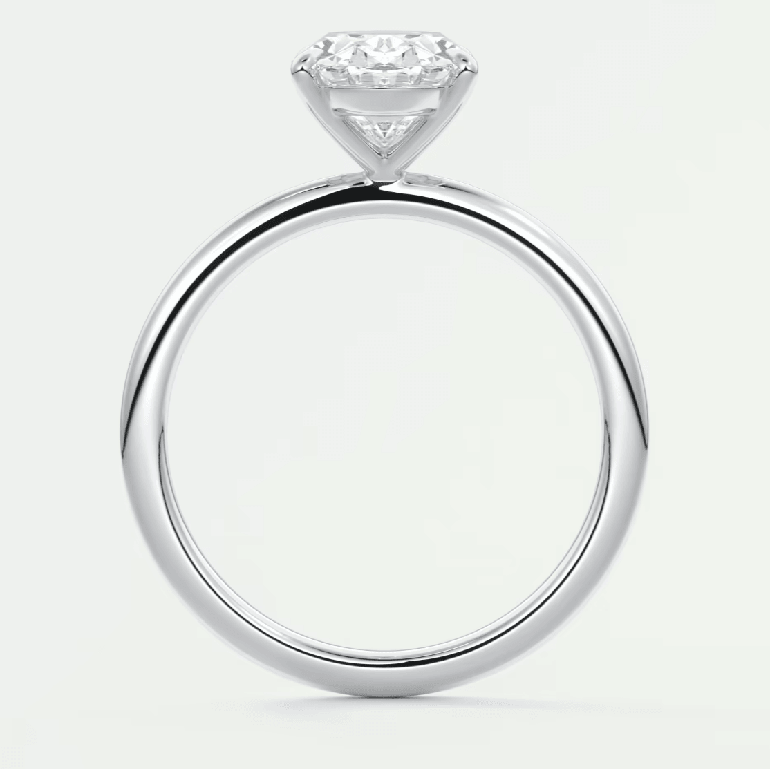 18k white gold solitaire diamond engagement ring with a round brilliant cut gem.