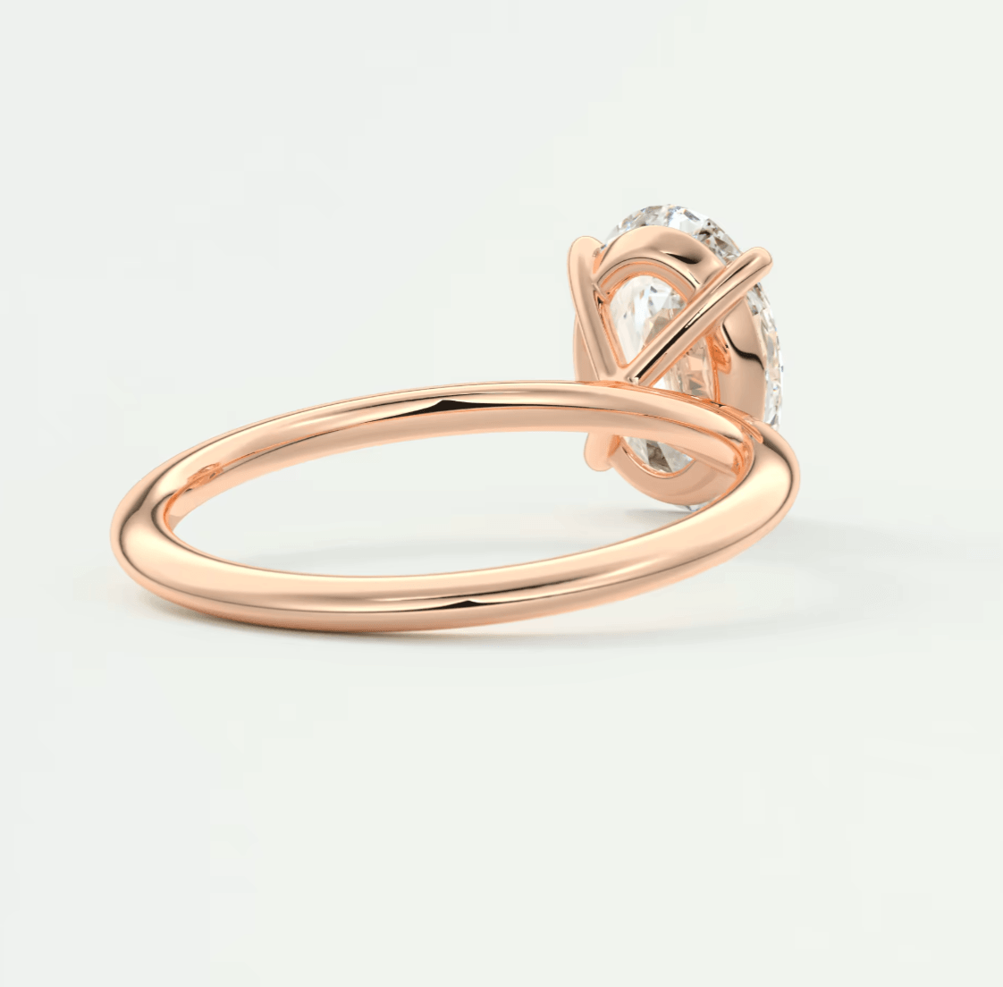 18k rose gold diamond engagement ring with a solitaire design.