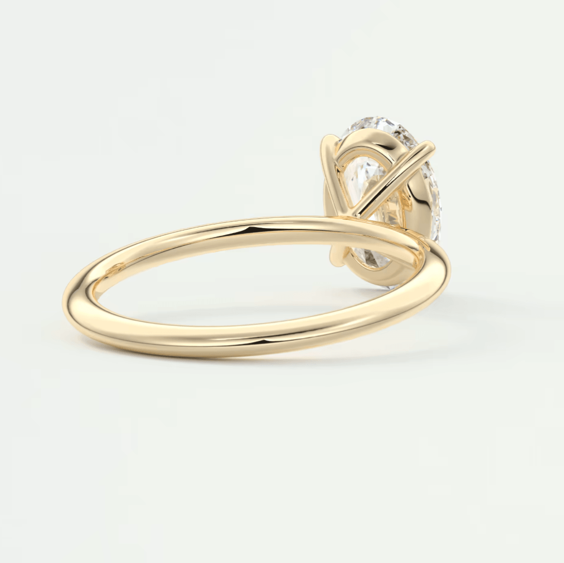 18k yellow gold engagement ring with a diamond center stone.