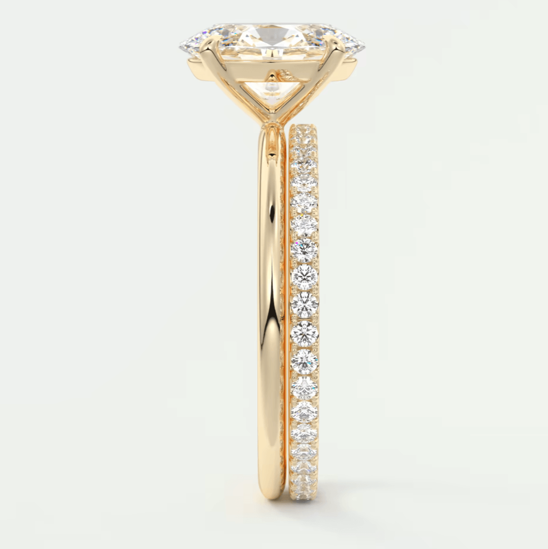 18k yellow gold diamond engagement ring with a princess cut center stone and pave set diamonds on the band.