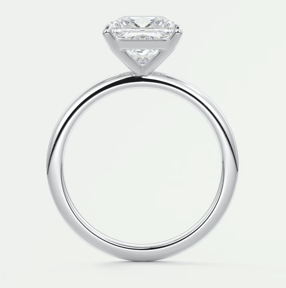 18k white gold engagement ring with a princess cut diamond.