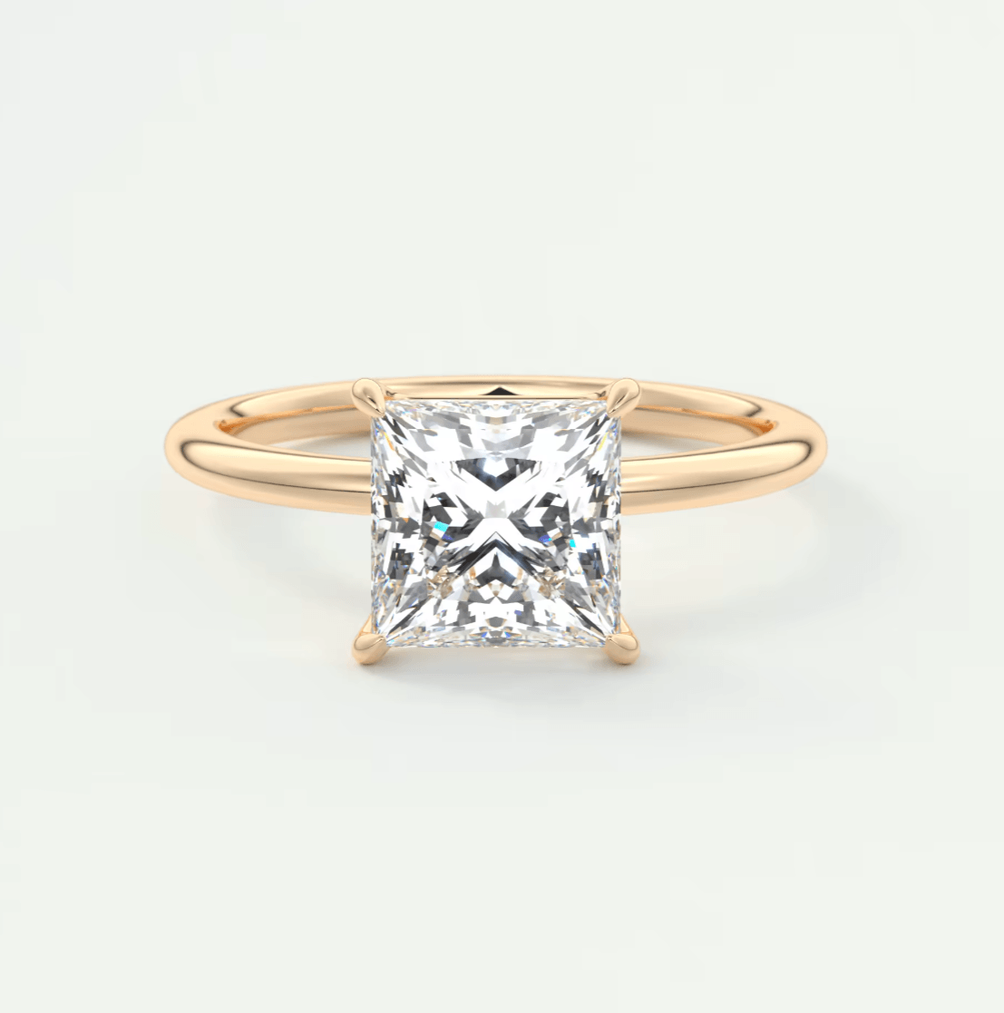 18-karat gold princess cut diamond engagement ring.
