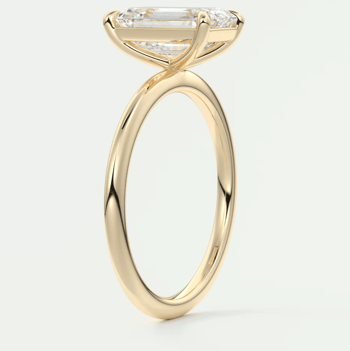 18k yellow gold engagement ring with a princess cut diamond and small round diamonds on the band.