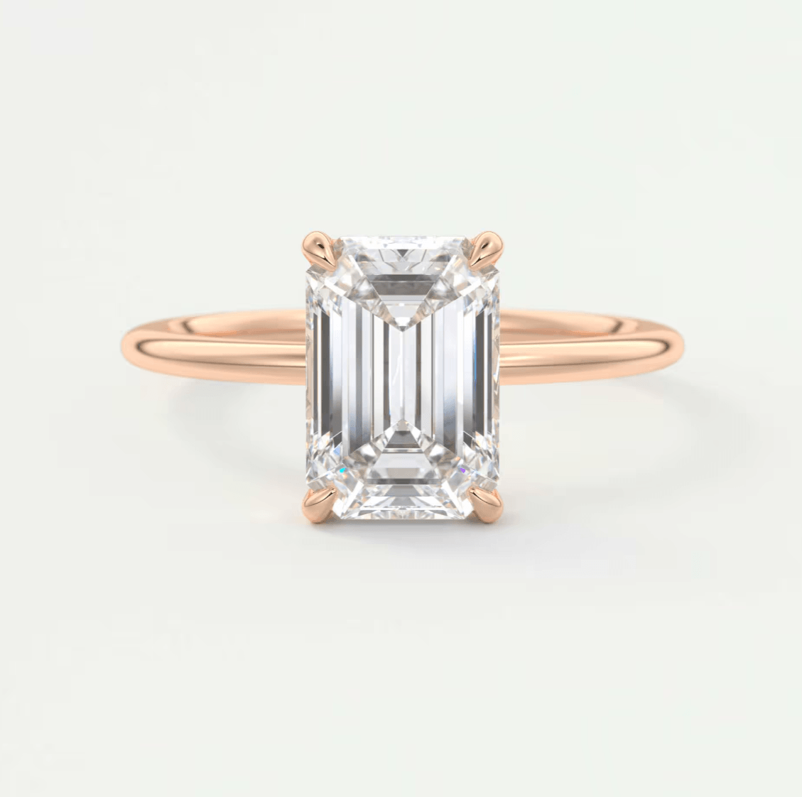 18k rose gold emerald cut diamond engagement ring.
