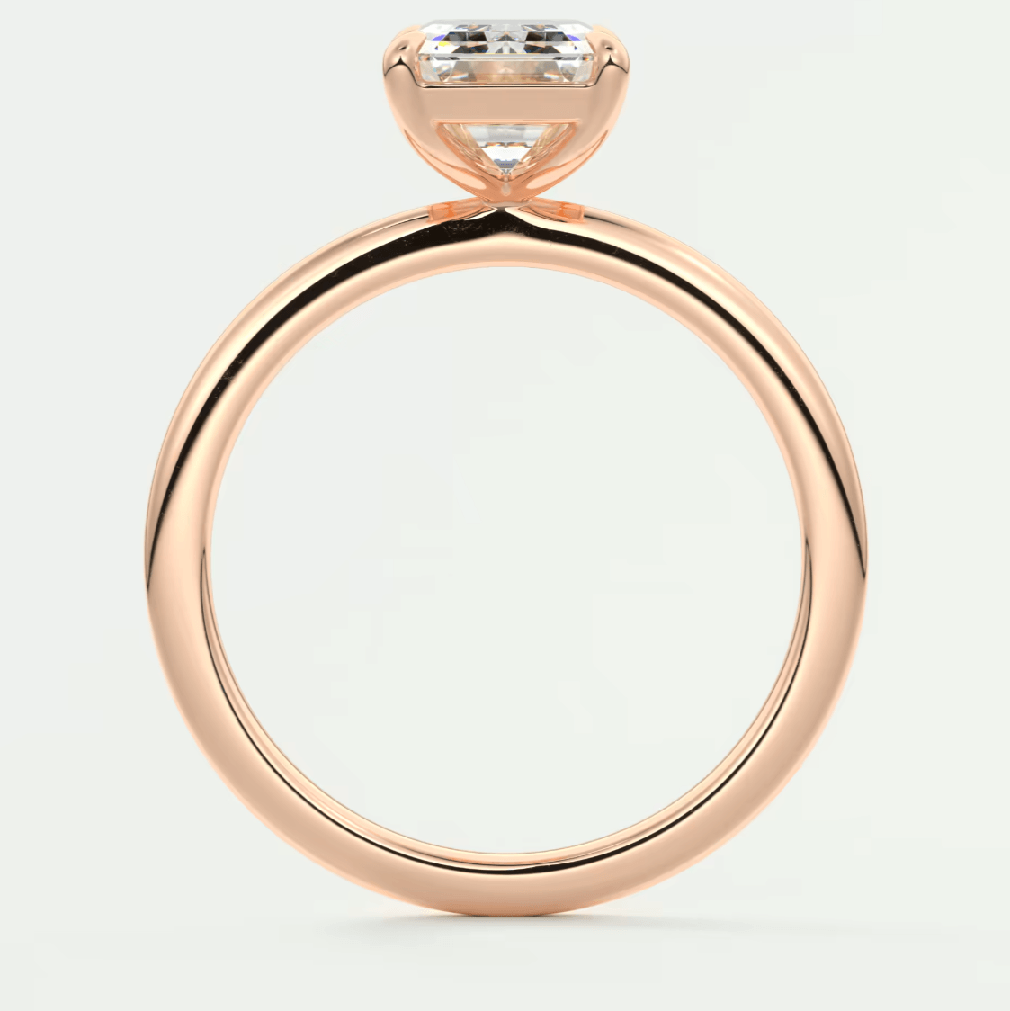 Rose gold engagement ring with a princess cut diamond.