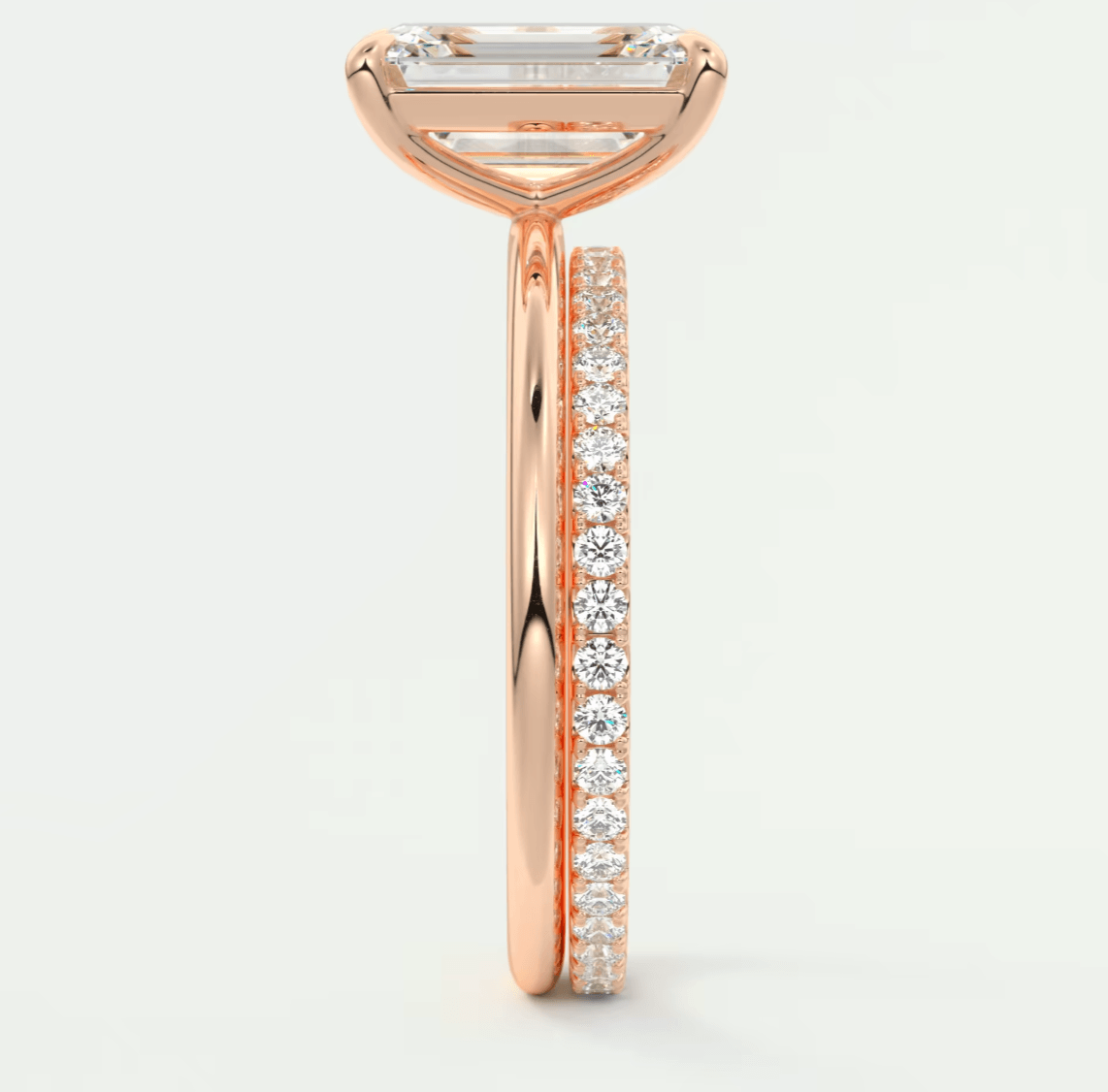 18-karat rose gold engagement ring with a princess-cut diamond and pave-set diamonds on the band.