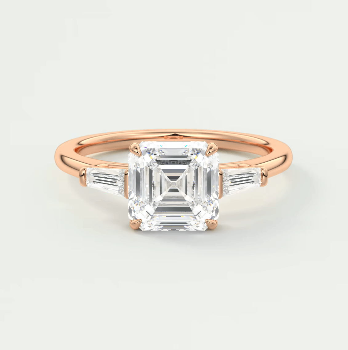 18-karat rose gold engagement ring with an asscher-cut diamond and baguette diamonds.