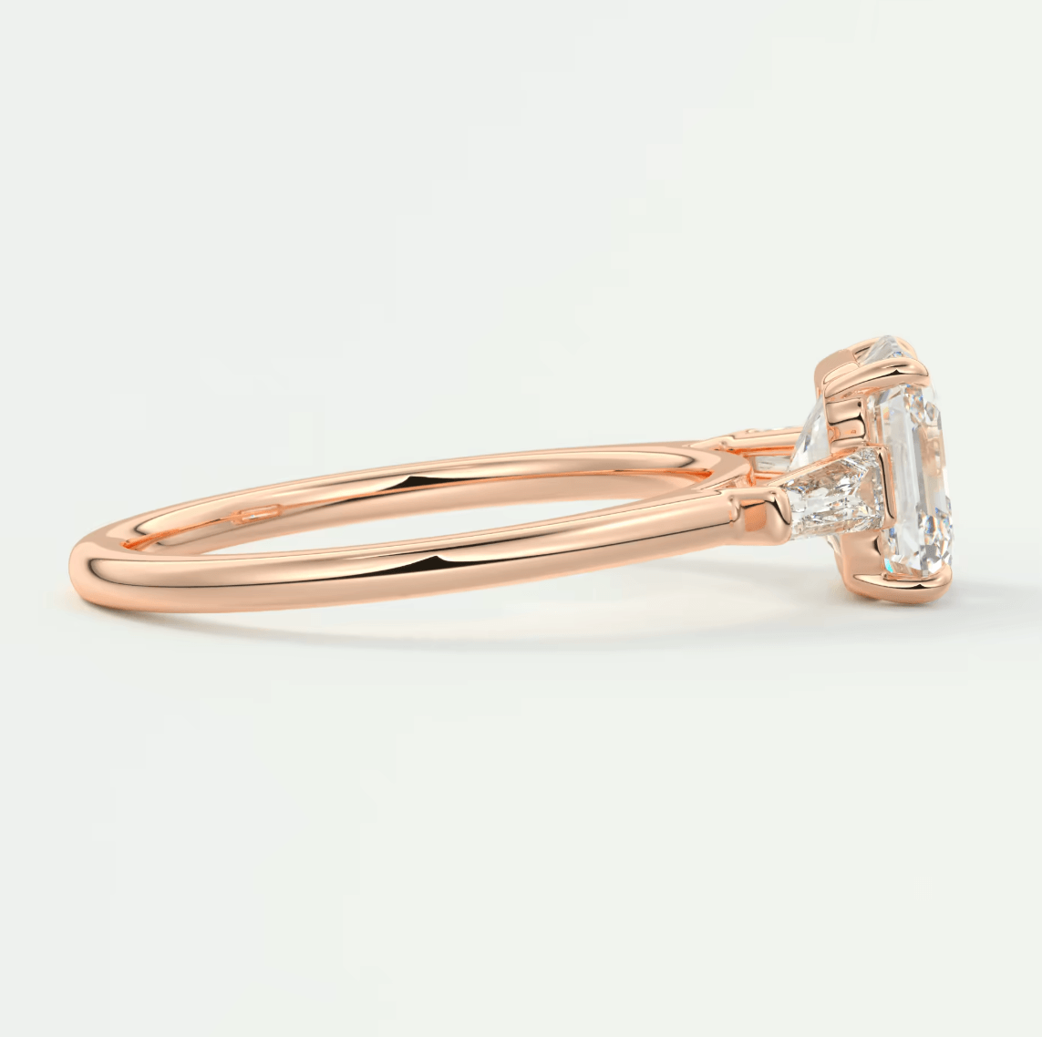 18-karat rose gold engagement ring with a marquise-cut diamond.