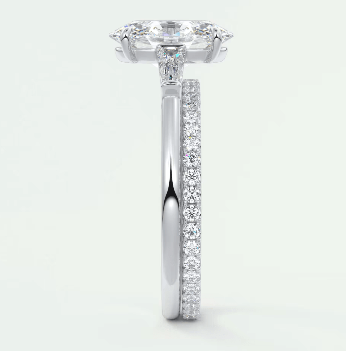 18k white gold diamond engagement ring with a cushion-cut center stone and pavé set diamonds on the band.