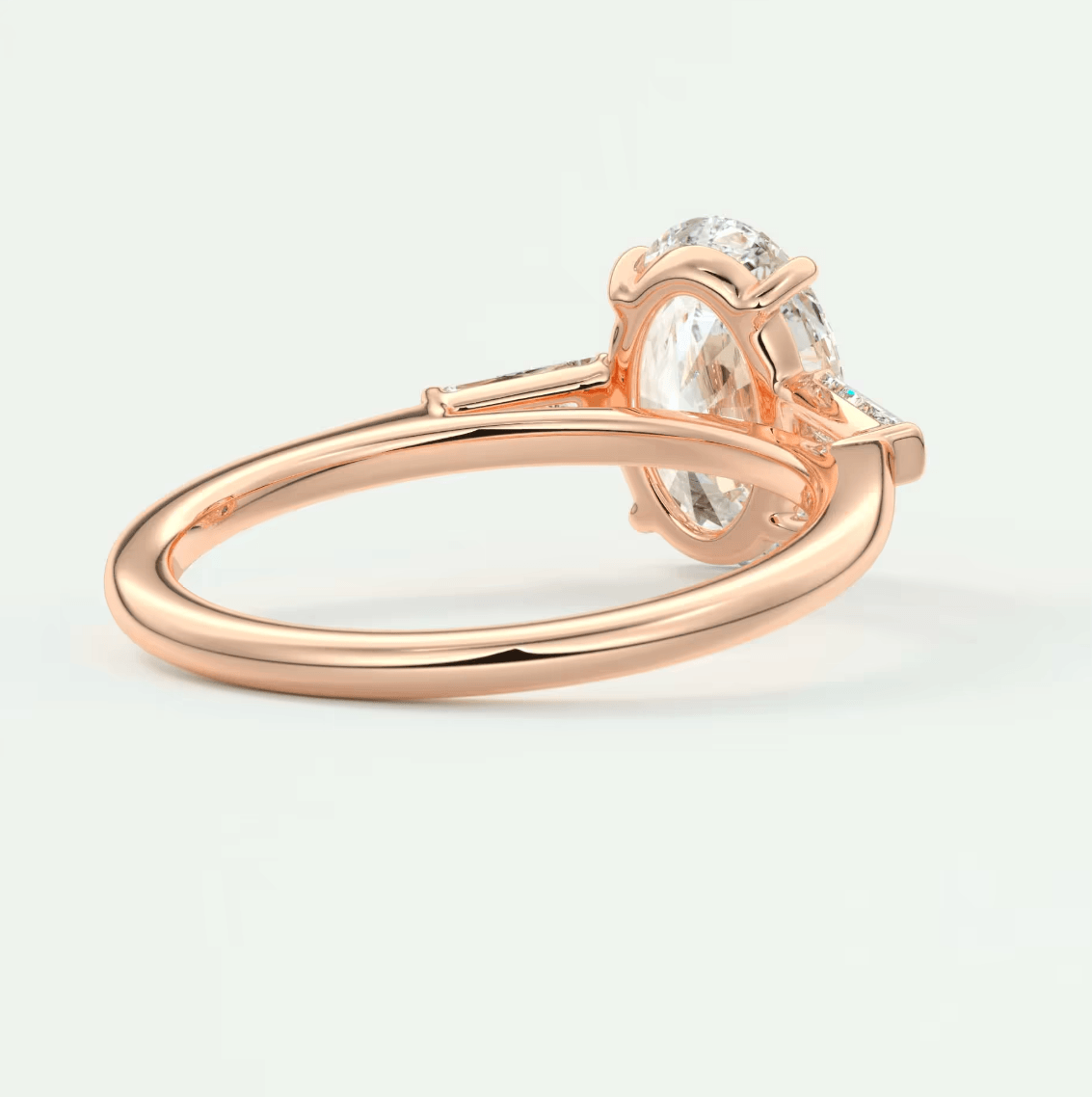 18k rose gold engagement ring with a cushion-cut morganite and diamond accents.