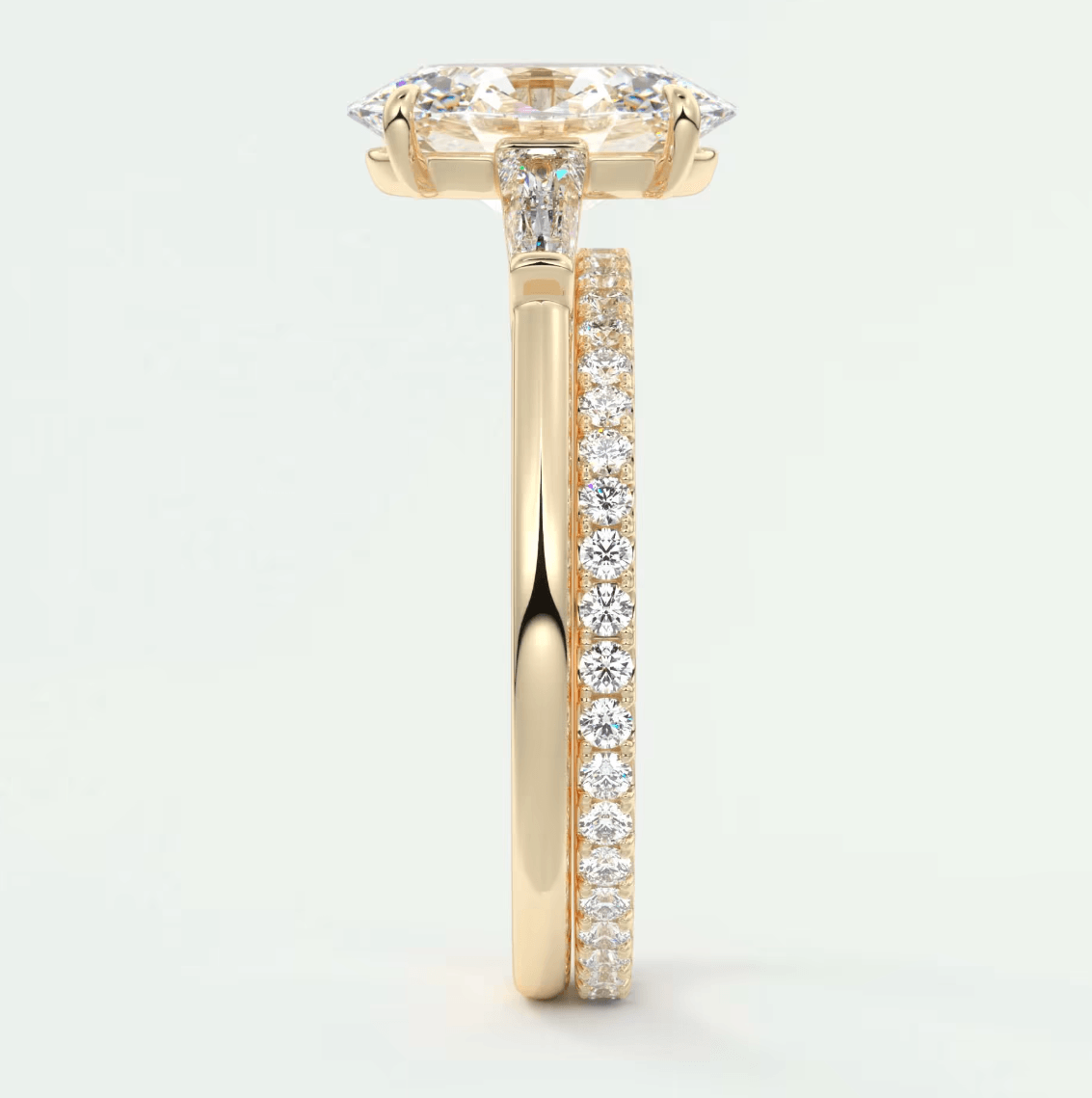 18k yellow gold diamond engagement ring with a marquise-cut center stone and pave set diamonds on the band.
