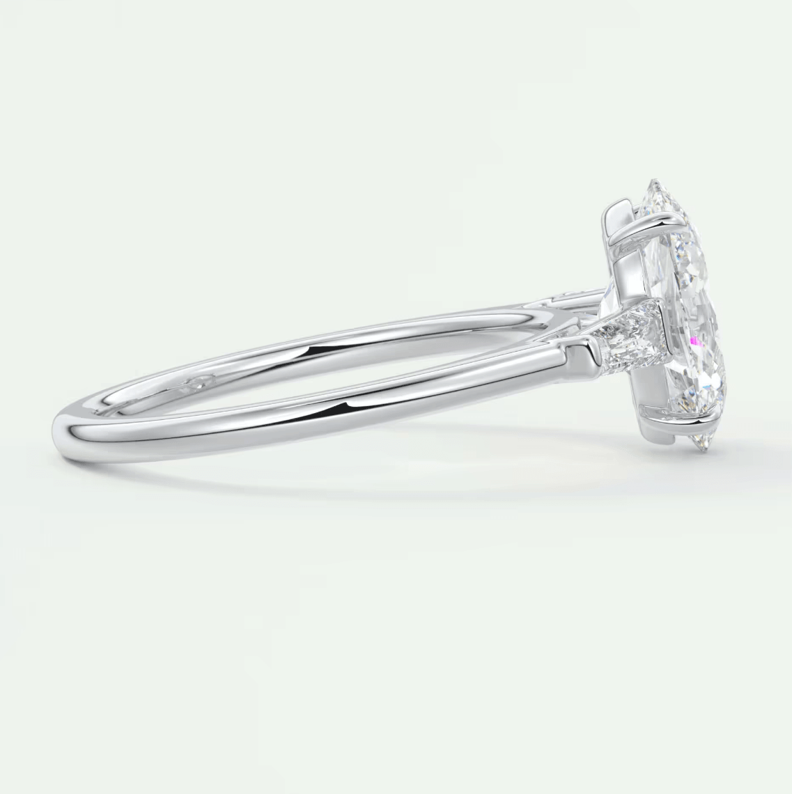 18k white gold diamond engagement ring with a marquise-cut center stone and pave-set diamonds on the band.