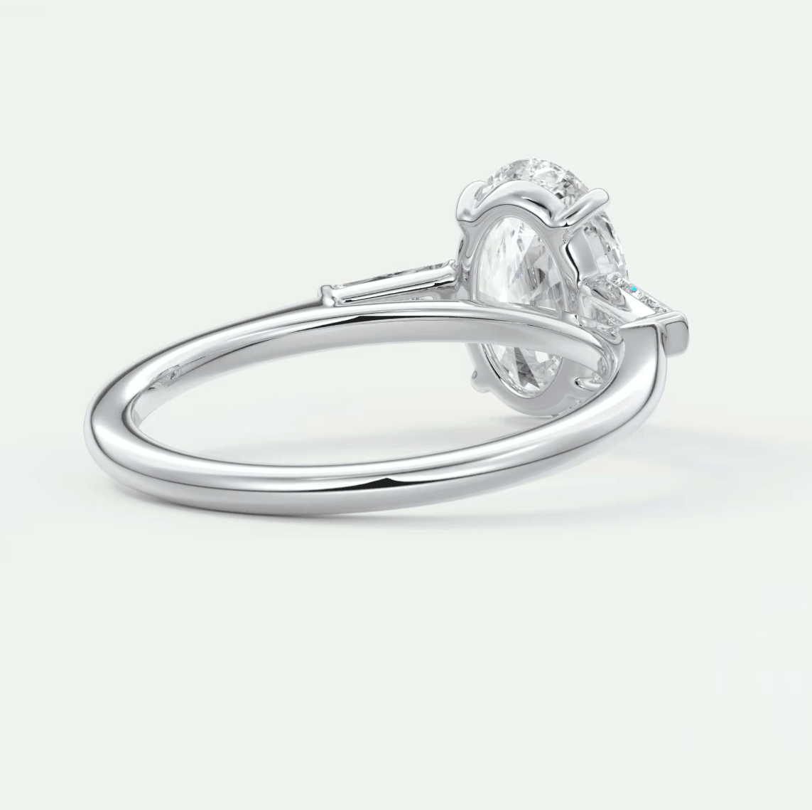 18k white gold oval diamond engagement ring with a solitaire setting.