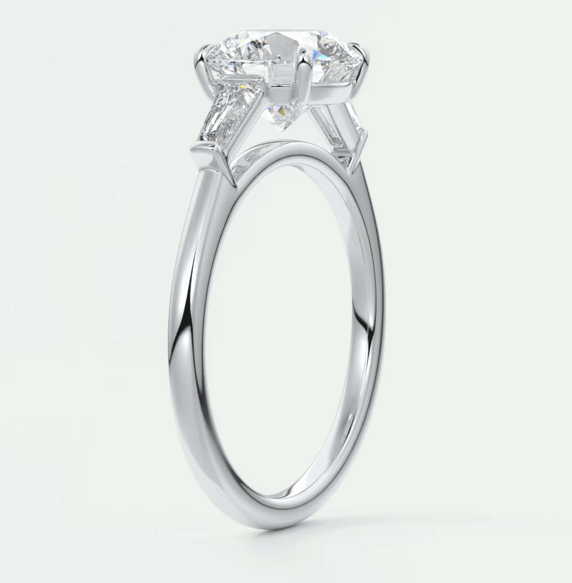 18-karat white gold engagement ring with princess-cut diamond and side diamonds.