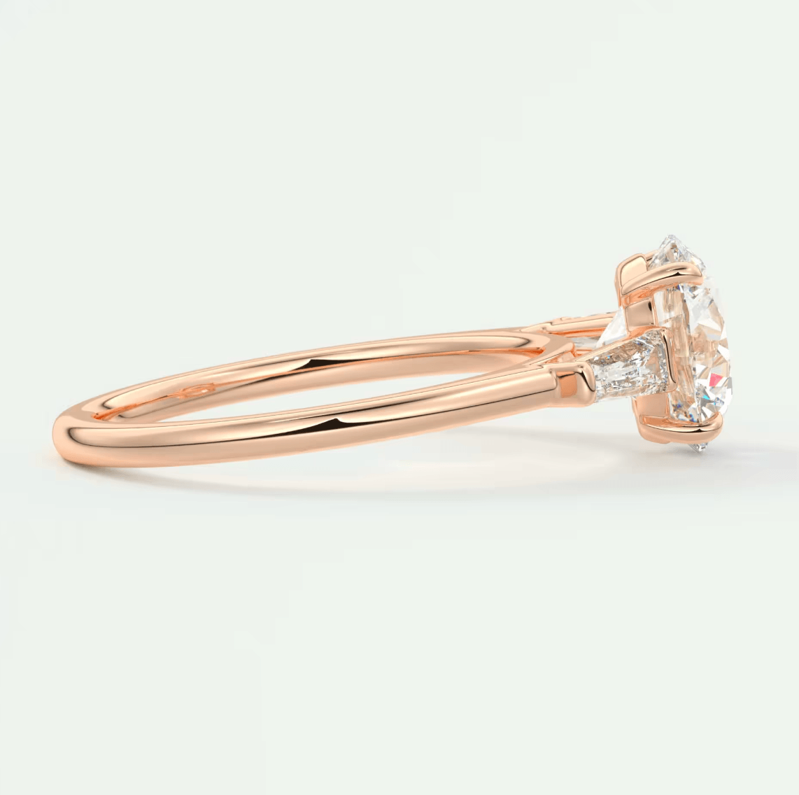 18-karat rose gold engagement ring with a round diamond.