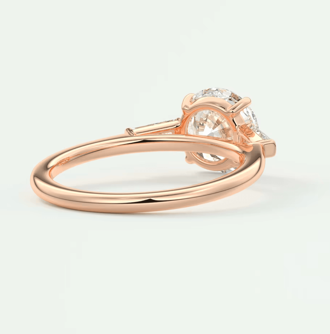 Rose gold diamond engagement ring with a solitaire design and prong setting.