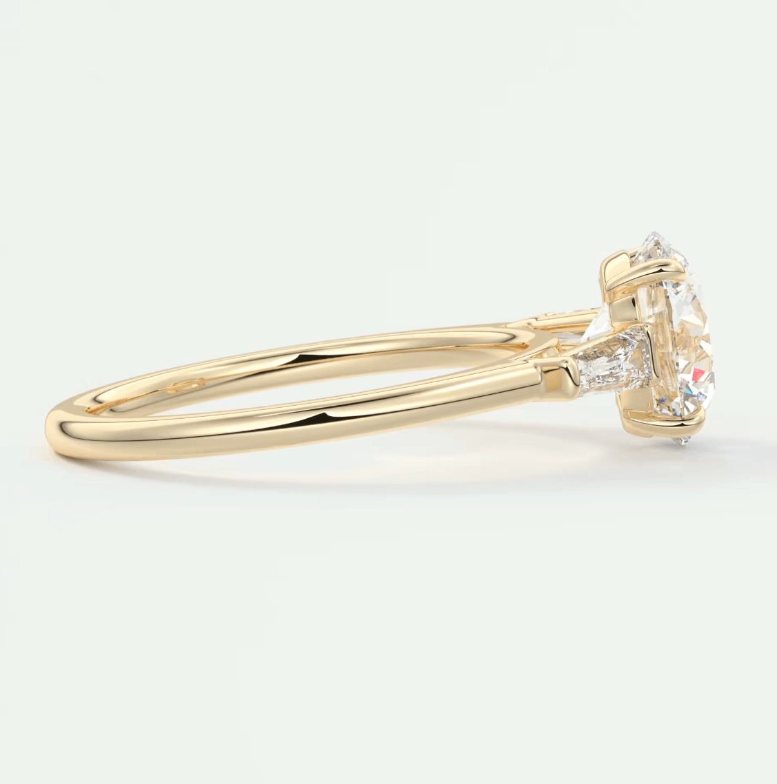 14k yellow gold engagement ring with a round diamond center stone and small diamonds on the band.