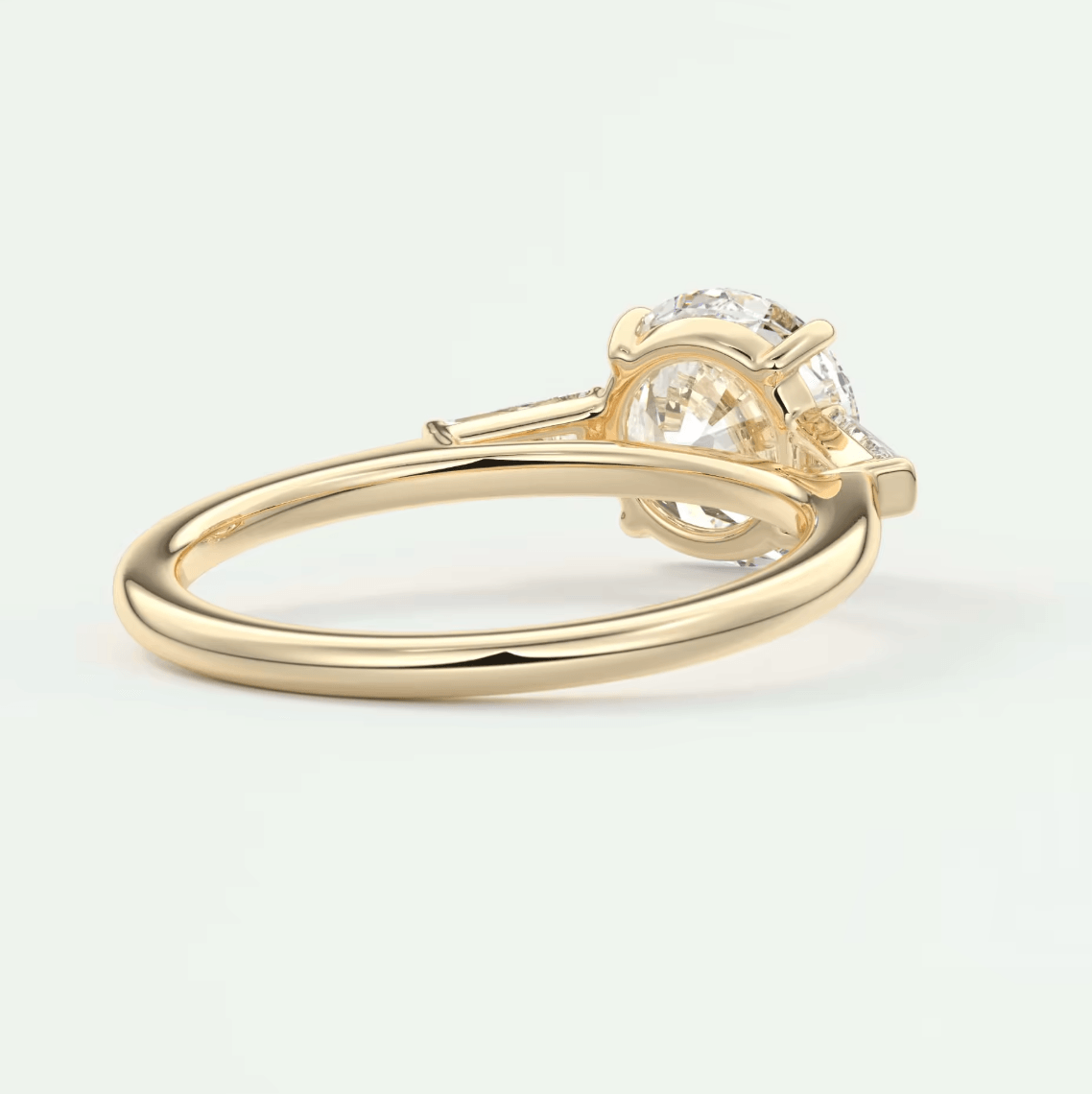 18k yellow gold solitaire engagement ring with a round diamond.