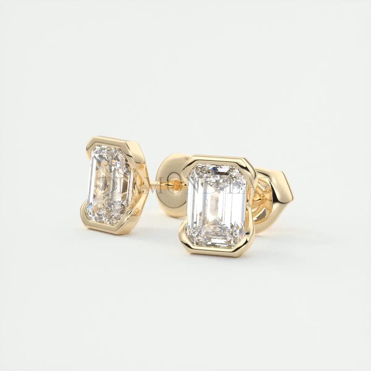 18k yellow gold diamond stud earrings with emerald-cut diamonds.