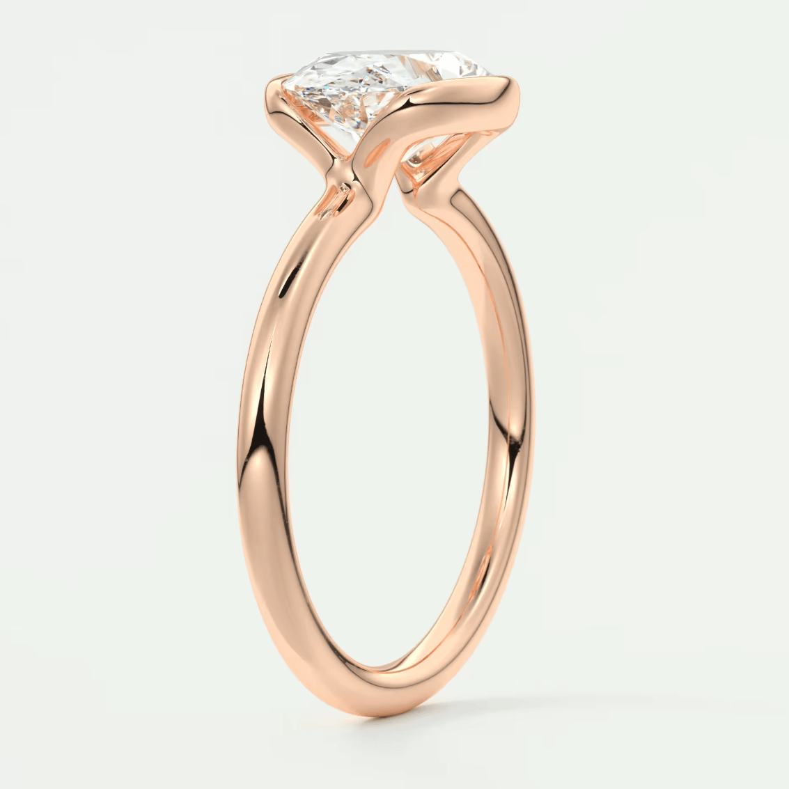Rose gold engagement ring with a princess cut diamond.