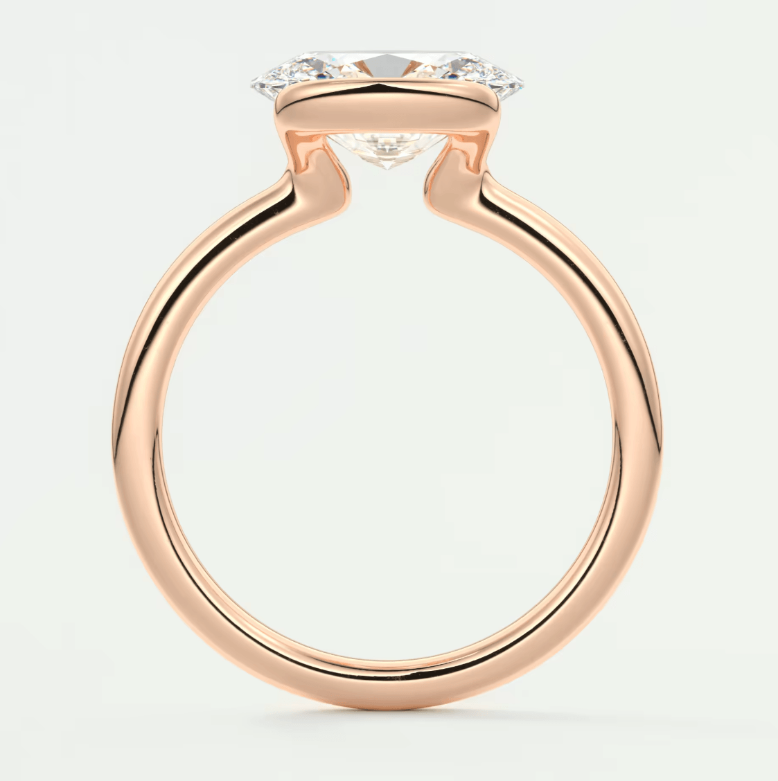 Rose gold diamond engagement ring with a cushion-cut center stone and halo detailing.