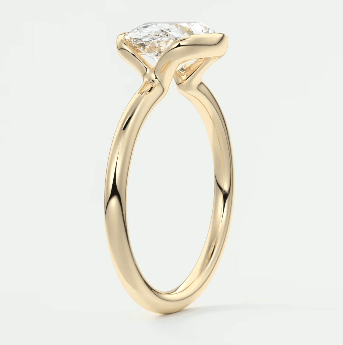 18k yellow gold engagement ring with a princess cut diamond.