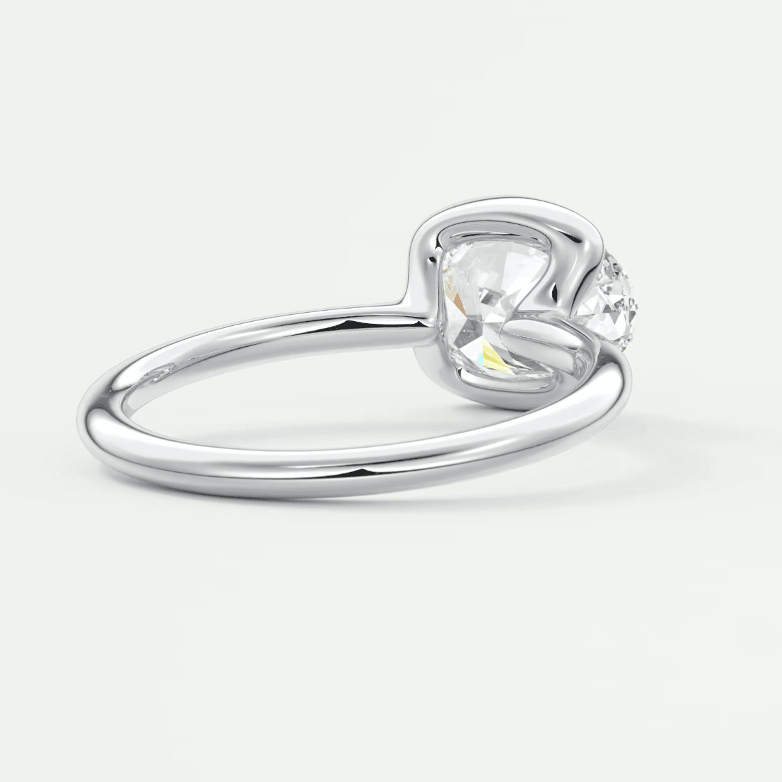 Silver heart-shaped diamond engagement ring with a single stone set in prongs.