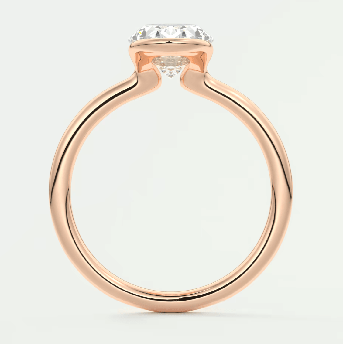 Rose gold diamond engagement ring with a cushion-cut center stone.