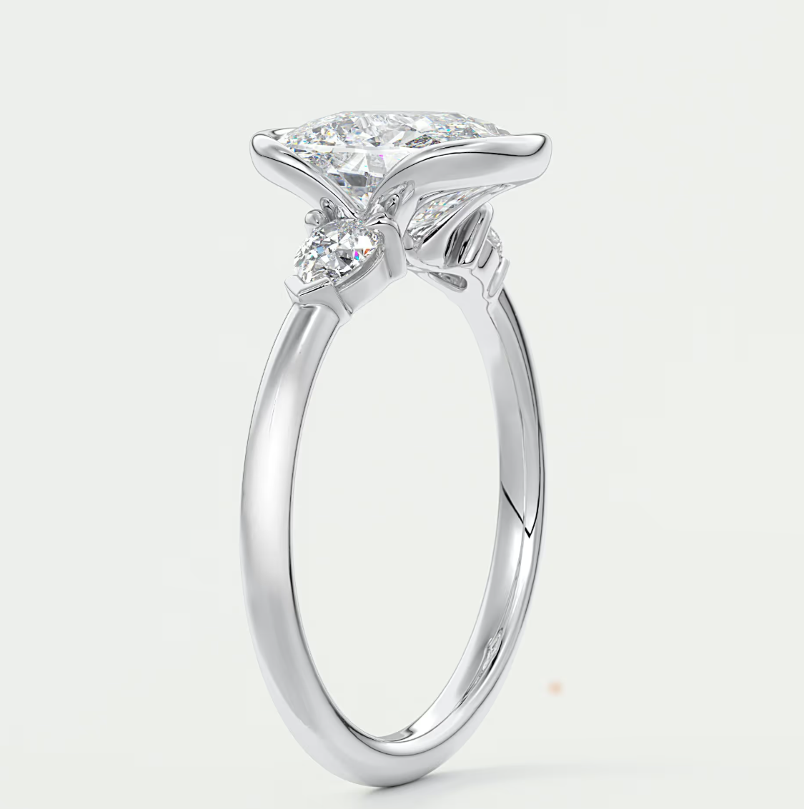 Solara Elongated Cushion Half Bezel Three-Stone Engagement Ring