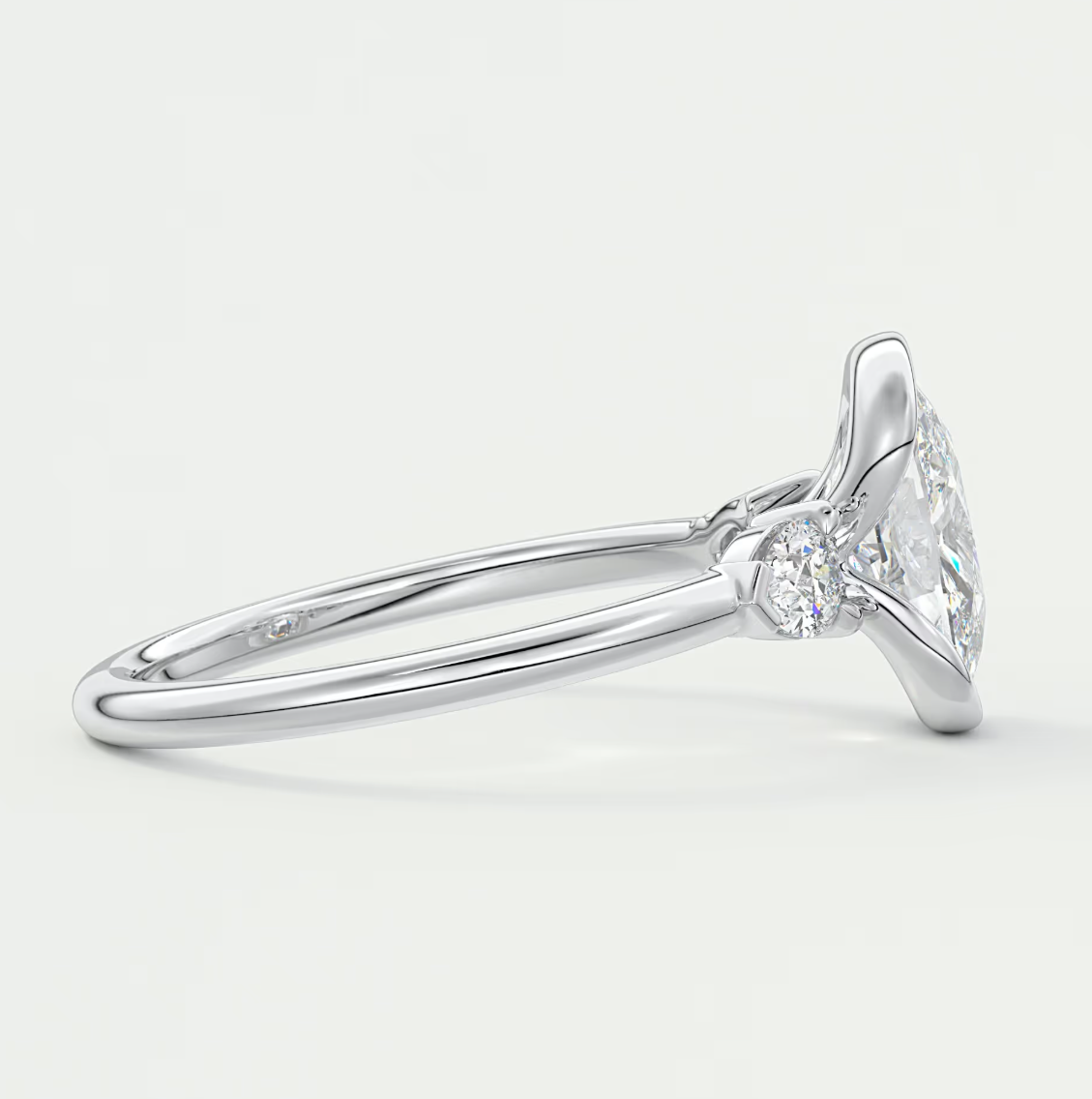 Solara Elongated Cushion Half Bezel Three-Stone Engagement Ring