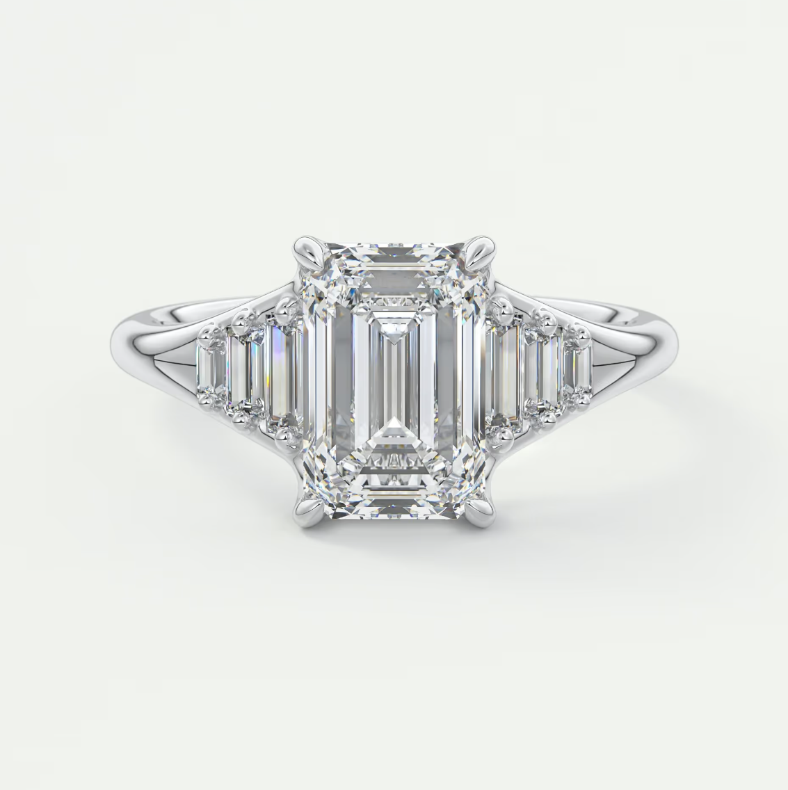 Solena Emerald Split Shank Engagement Ring with Graduated Baguette Side Stones