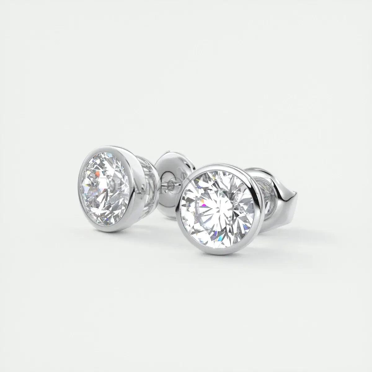 18k white gold diamond stud earrings with bezel setting.