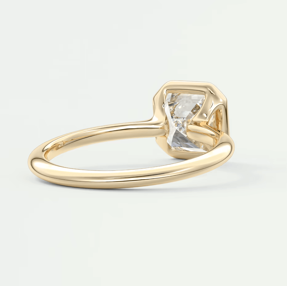 18k gold engagement ring with a princess cut diamond.