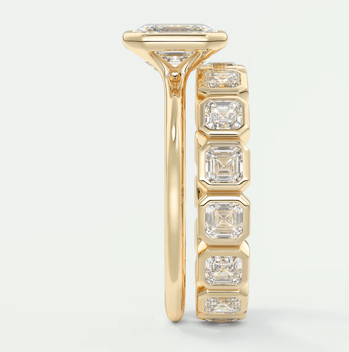 18k yellow gold diamond engagement ring with a cushion-cut center stone and princess cut side stones.