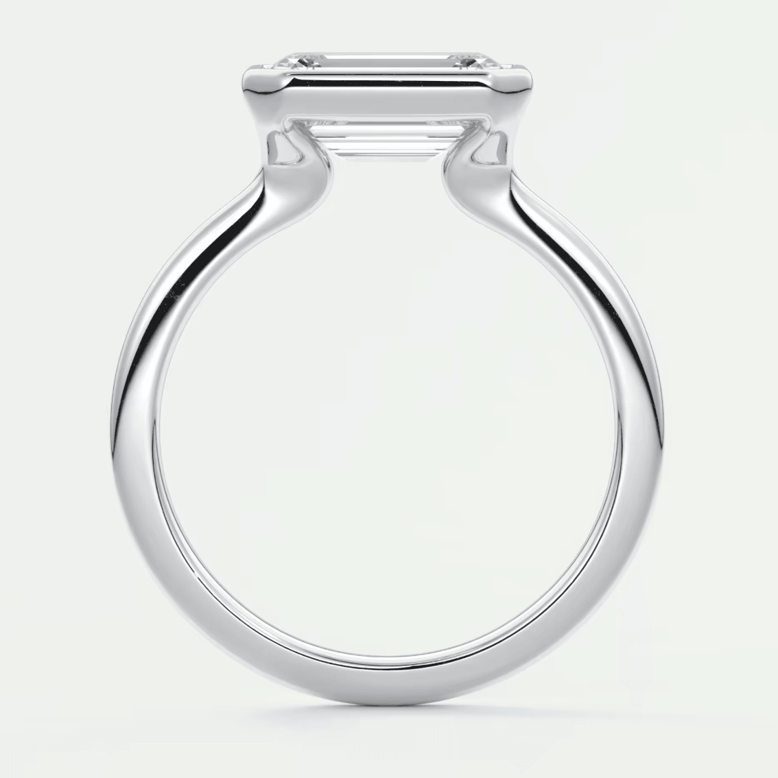 White gold engagement ring with a square diamond.