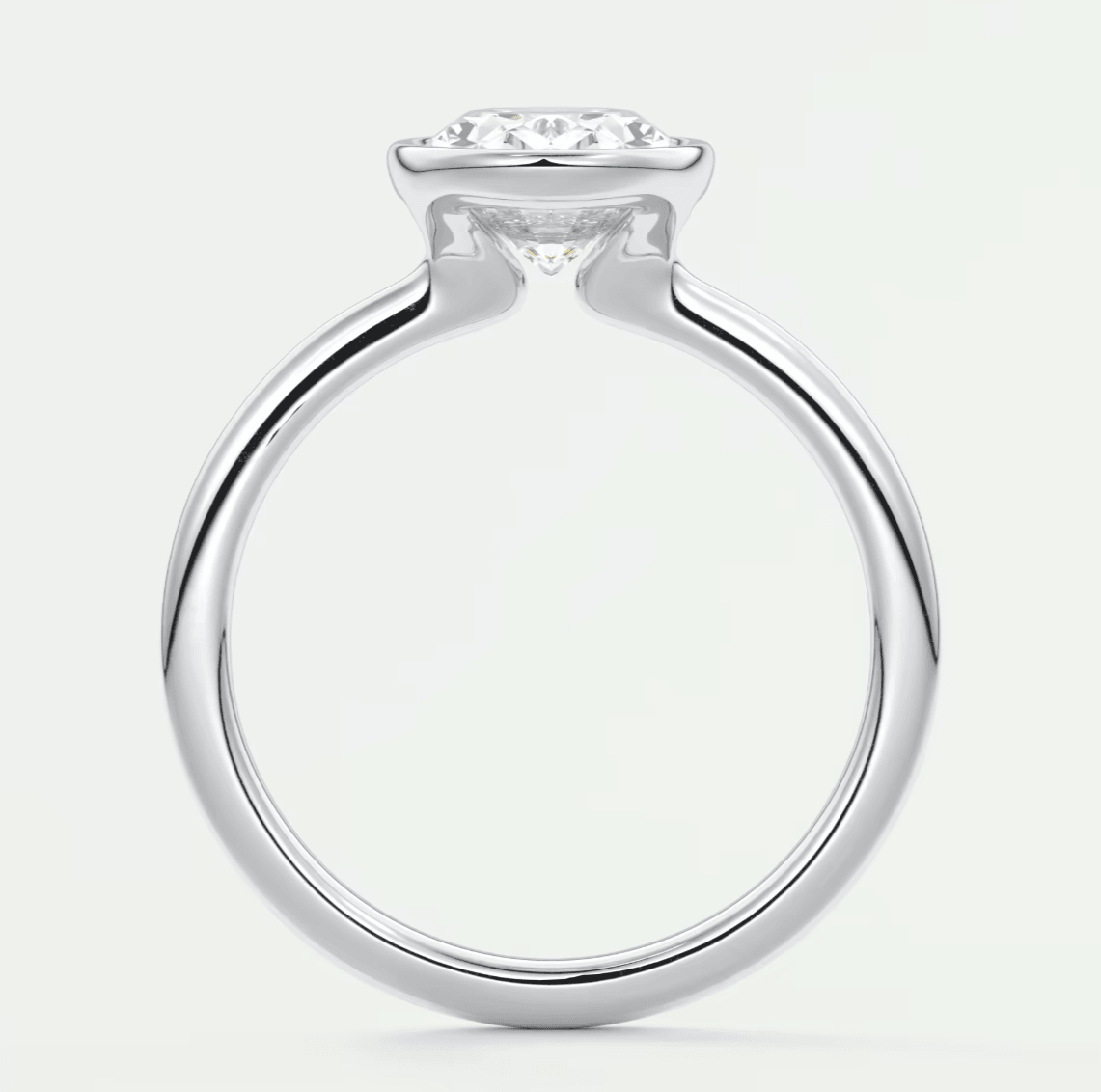 White gold engagement ring with a diamond center stone and curved band design.