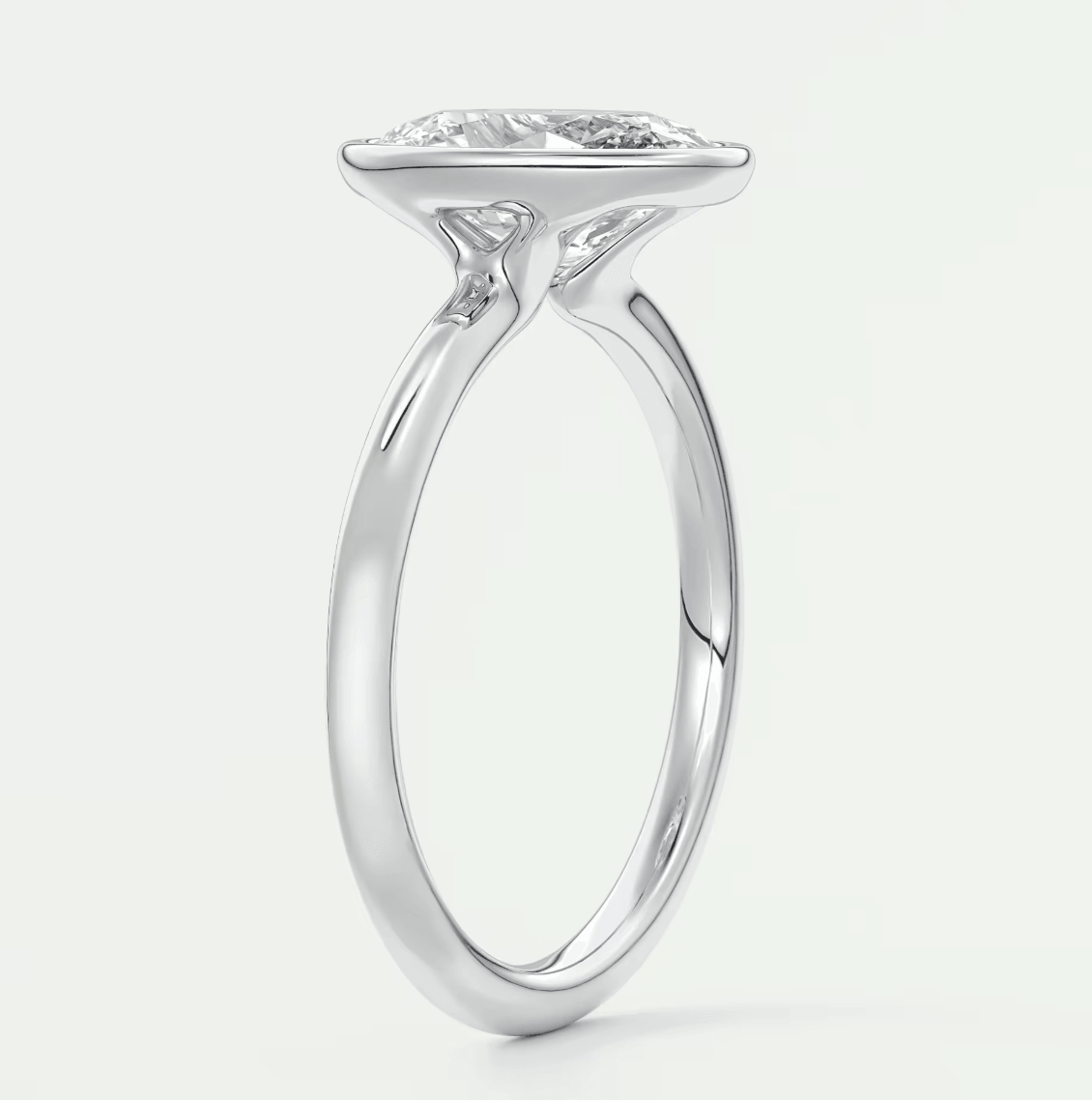 18-karat white gold engagement ring with a marquise-cut diamond.