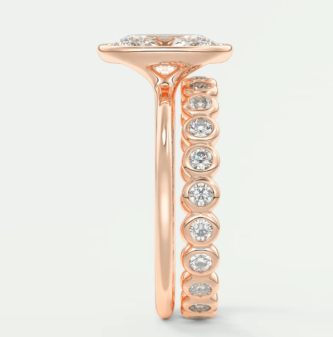 18k rose gold diamond engagement ring with a halo setting and band.