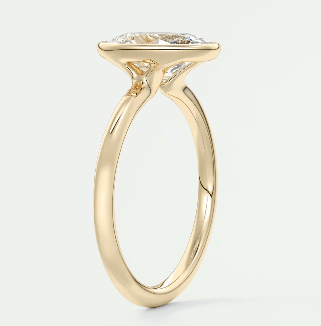 18-karat yellow gold engagement ring with a marquise-cut diamond.