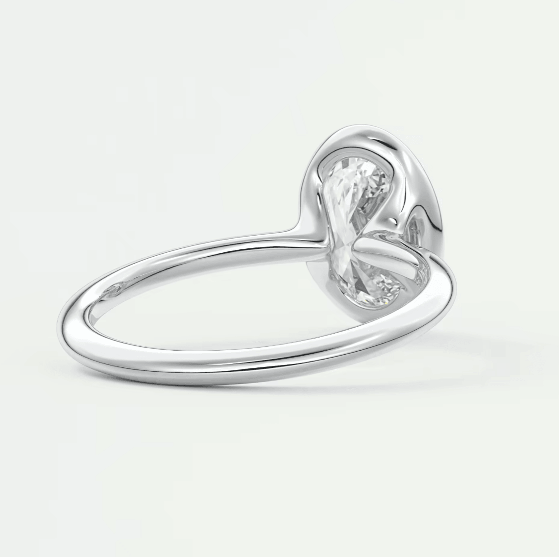 Silver heart-shaped diamond ring with a polished finish and elegant design.