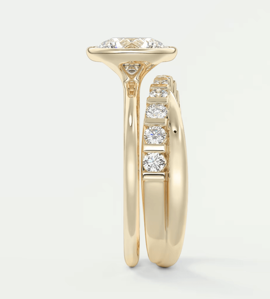 18k yellow gold diamond engagement ring with a cushion-cut center stone and channel-set side diamonds.