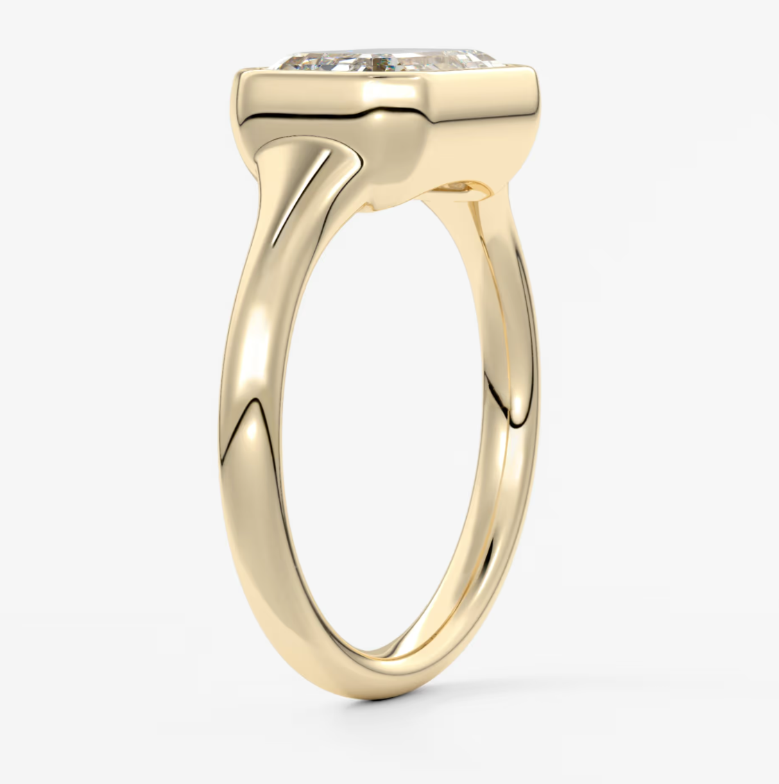 Yellow gold engagement ring with a cushion-cut diamond.