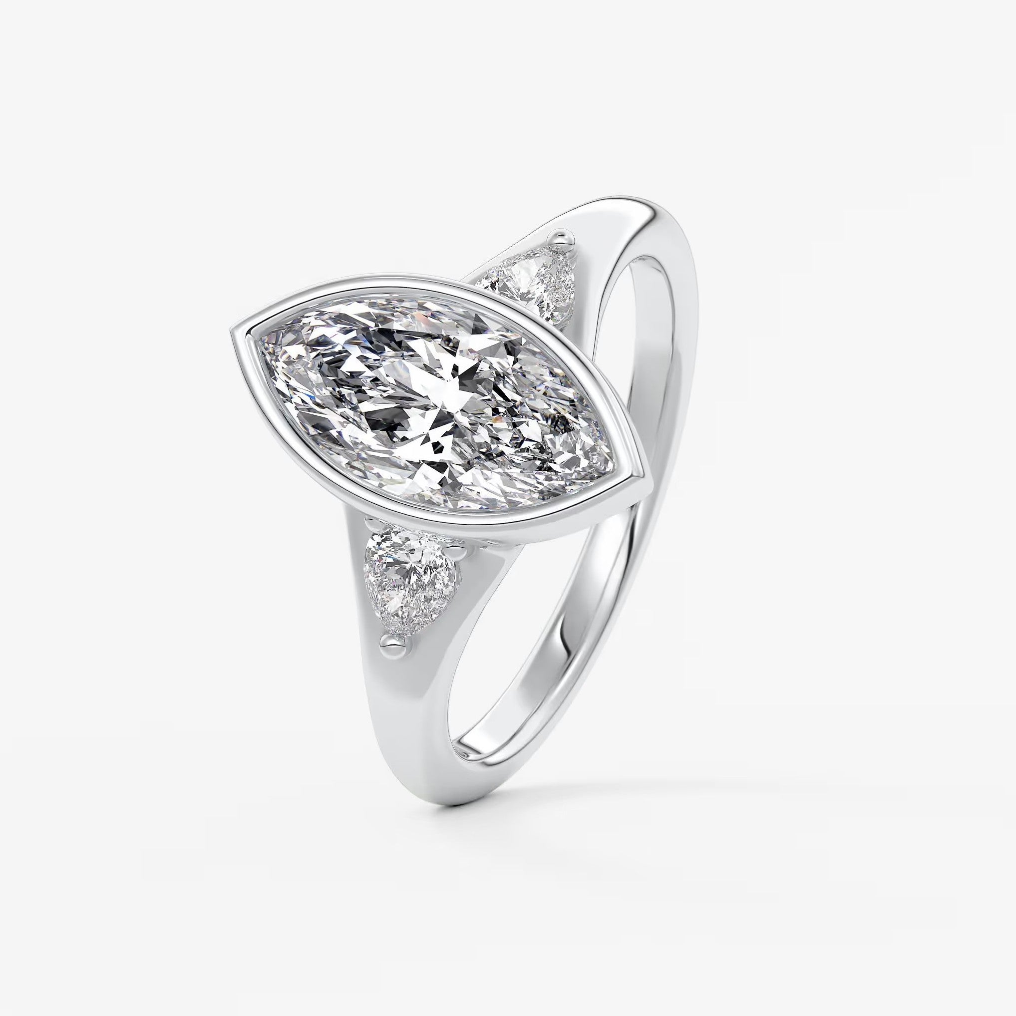 Véda trilogy – marquise with pear side stones