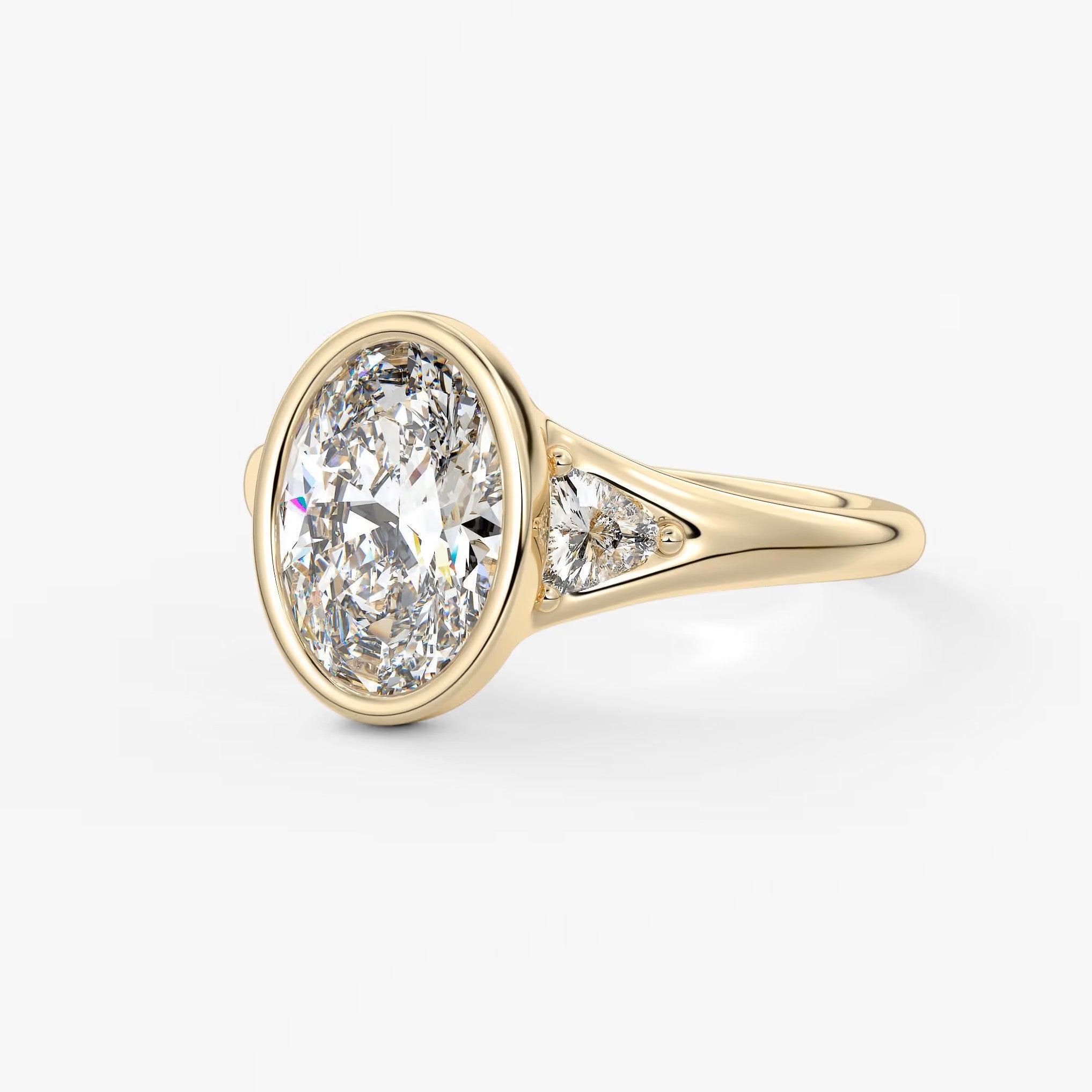 Véda trilogy – oval with trillion side stones
