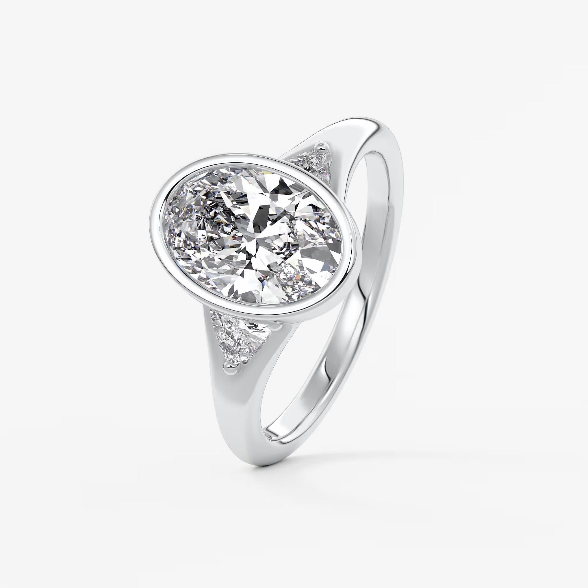 Véda trilogy – oval with trillion side stones