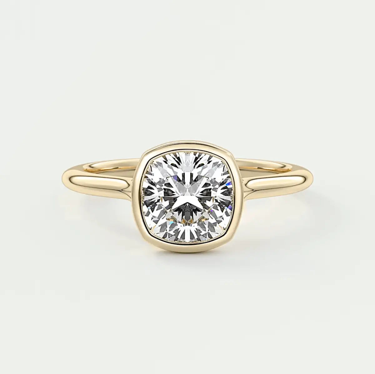 18k yellow gold cushion-cut diamond engagement ring.