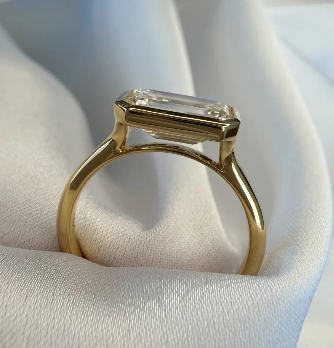 Custom made aeris east-west emerald bezel lab diamond ring 2.08ct d vvs2 | 18k yellow gold